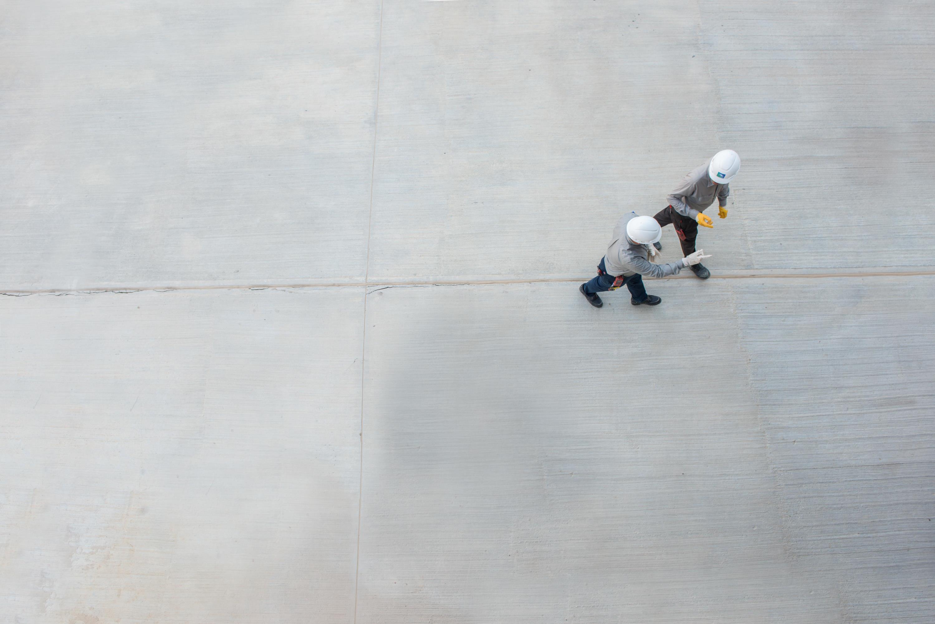 Aramco engineers walking and talking to each other