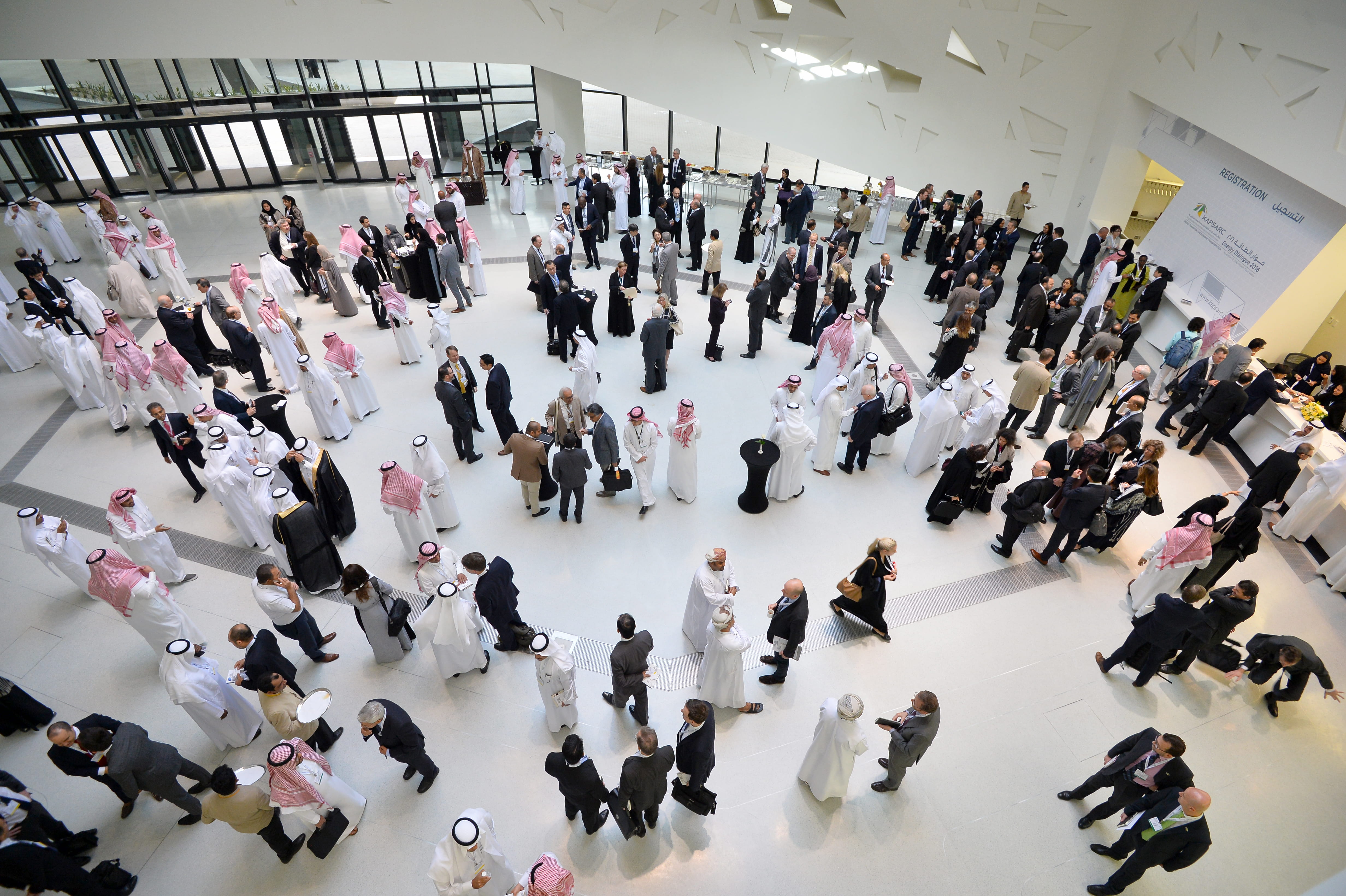 Crowd of people networking at a conference