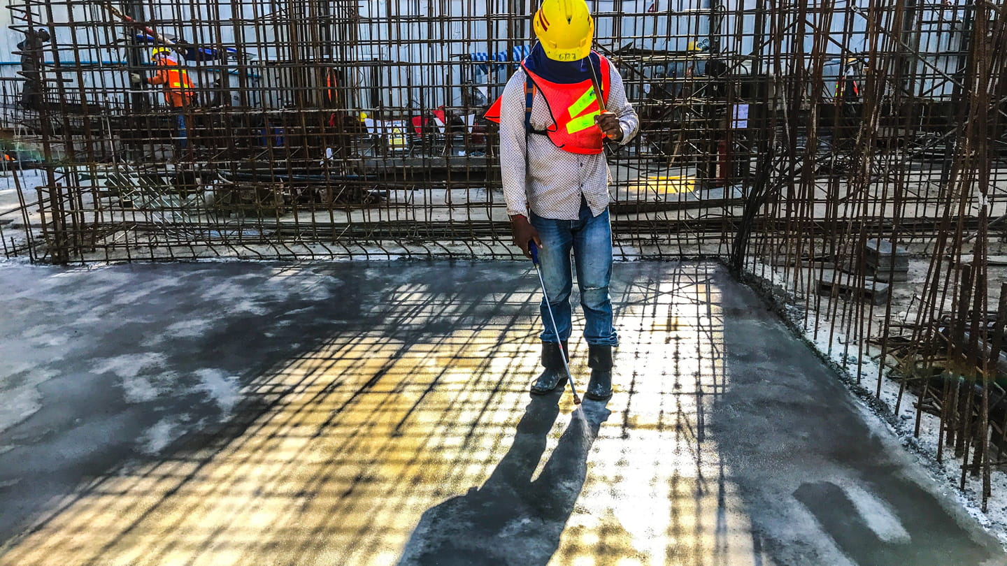 construction worker water concrete floor