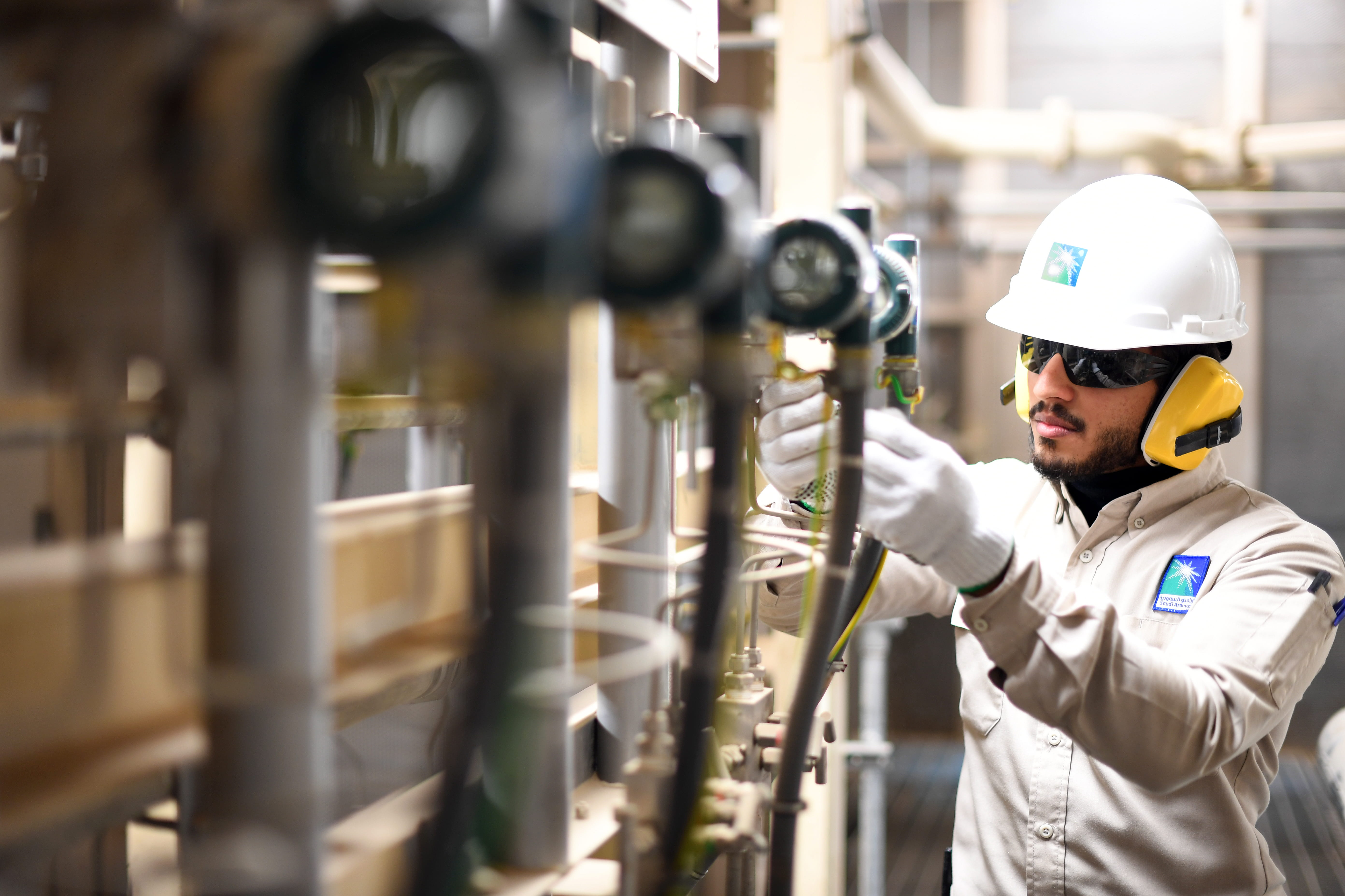 Saudi Aramco worker in safety gear at Wasit gas plant