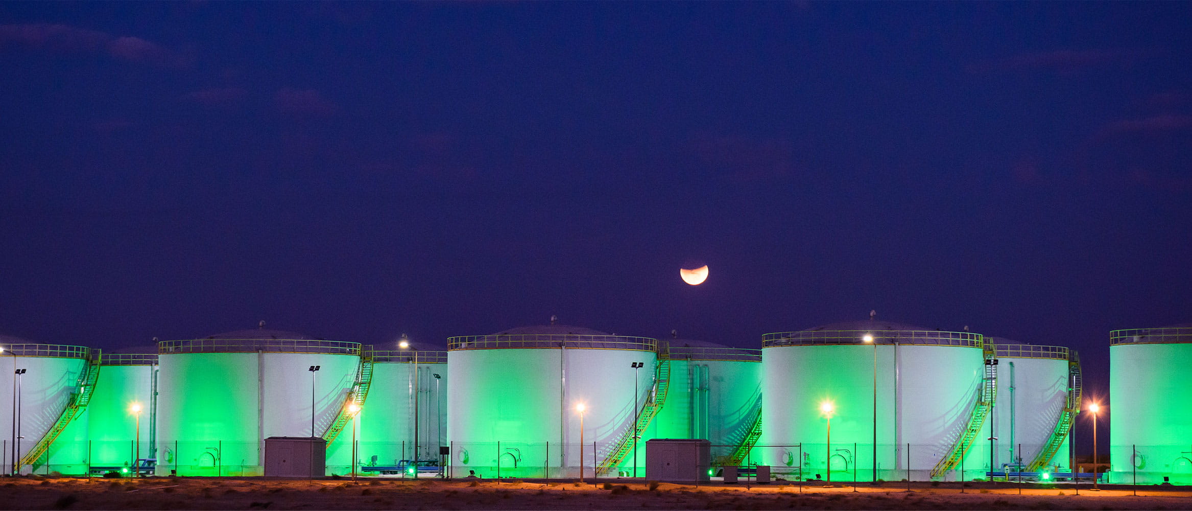 Oil/gas tank storage facilities Saudi Aramco at night
